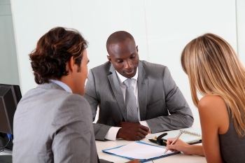 Couple Signing a Document